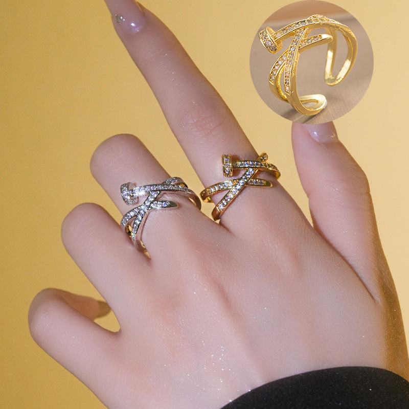 A Diamond Studded Zircon Nail Layered Open Ring