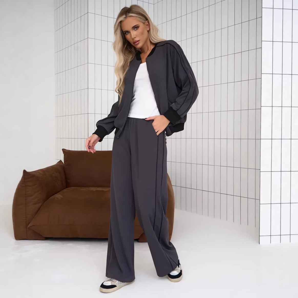 Two Piece Set Featuring A Color Blocked Cardigan With Zippers And Matching Pants