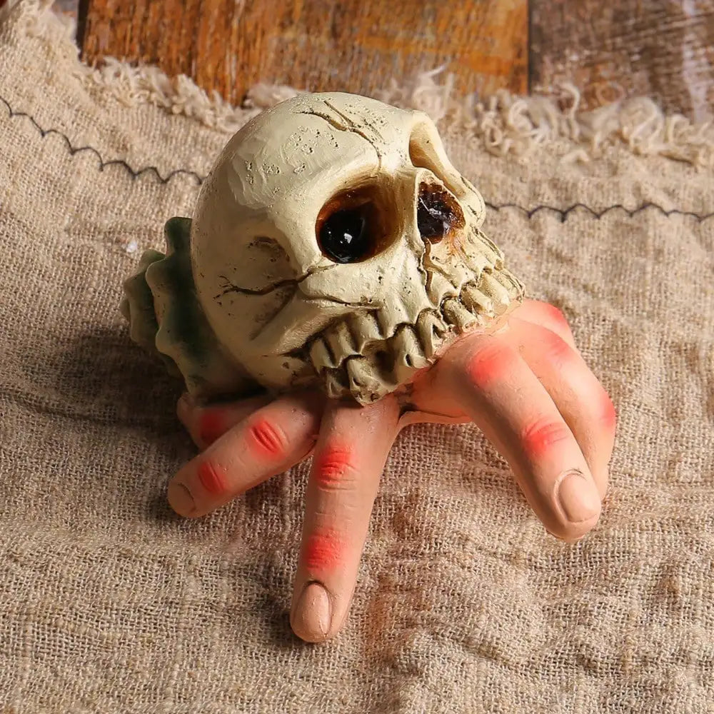 Halloween resin hand held skull ornament, terrifying and realistic skull, suitable for decorating haunted houses and parties